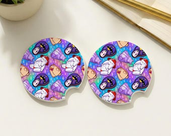 May include: Two white ceramic car coasters with a colorful pattern of cartoon characters in various poses. The design includes characters with red hats, purple and black masks, and tan faces, set against a gradient background of purple, blue, and pink.