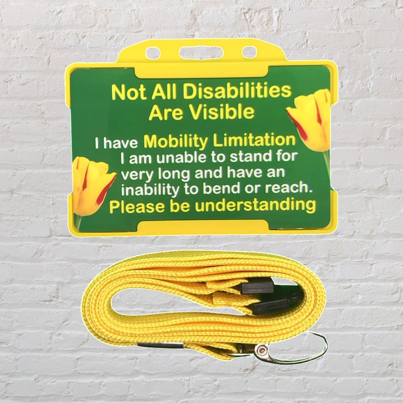 May include: Yellow lanyard with a plastic ID card holder. The card has a green background with a yellow tulip and the text "Not All Disabilities Are Visible. I have Mobility Limitation. I am unable to stand for very long and have an inability to bend or reach. Please be understanding."