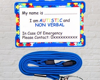 Puede incluir: Porta-tarjetas de identificación de plástico azul con un cordón. La tarjeta tiene un diseño de piezas de rompecabezas de colores y el texto "My name is", "I am AUTISTIC and NON VERBAL", "In Case Of Emergency Please Contact: 0xxxxxxxxx".