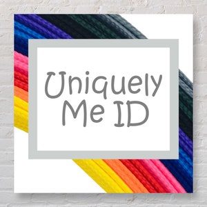 May include: A white square with a grey border and the text "Uniquely Me ID" in grey. The square is partially covered by a rainbow of colourful cords.