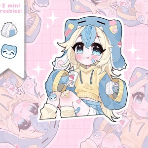 Puede incluir: Una ilustración de dibujos animados de una niña con cabello rubio que lleva una sudadera con capucha azul y amarilla y sostiene un teléfono. Está sentada sobre un fondo con estampado azul y blanco. El texto "TRY TRY AGAIN SHOP" está en el lado derecho de la imagen.