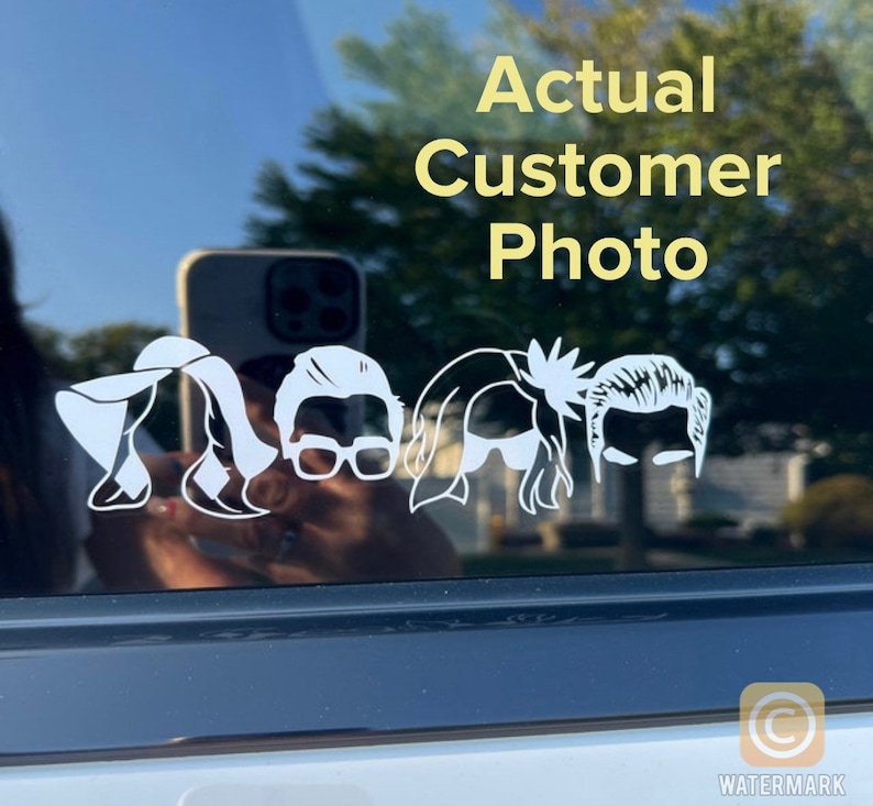 May include: A white vinyl decal of five stylized human figures, including a woman with a hat, a woman with long hair, a man with glasses, a woman with long hair, and a man with short hair. The decal is on the back window of a car. The text "Actual Customer Photo" is above the decal.