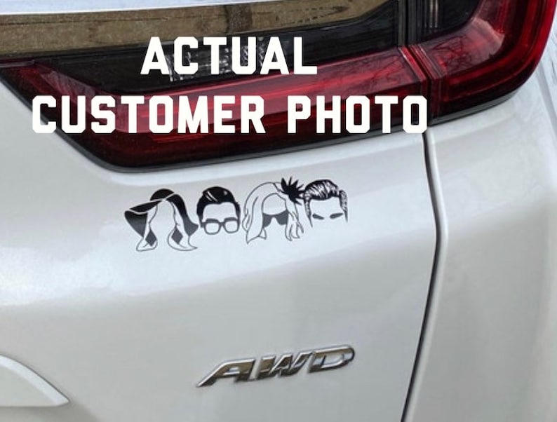 May include: A white car with a black decal of five stylized figures on the back. The decal is a silhouette of five people with different hairstyles. The text "ACTUAL CUSTOMER PHOTO" is above the decal.