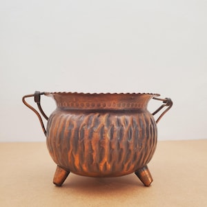 copper flowerpot, copper flowerpot cache pot. Vintage copper planter pot with (3) soleplates and handle shiny aged patina.