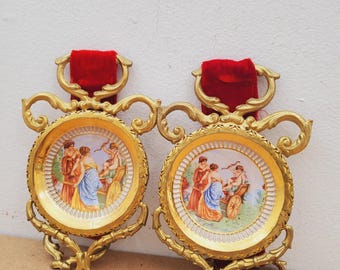 Decorative plates, set of tow handcrafted in Florence, Italian vintage, depicting a painting by Giotto, with baroque brass frame.