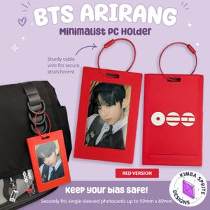 May include: Two red rectangular photo card holders with red cable wire loops for attachment. One holder displays a portrait of a person in a dark vest and white shirt. The other holder features three white circular and horizontal line symbols.