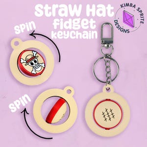 May include: A beige straw hat fidget keychain with a silver clasp and chain. The keychain has three spinning circle designs with red and white accents. One design features a skull and crossbones, another a red stripe, and the last a stitched pattern.