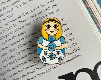 Nesting in Wonderland Alice hard enamel pin lapel rose gold russian matryoshka doll