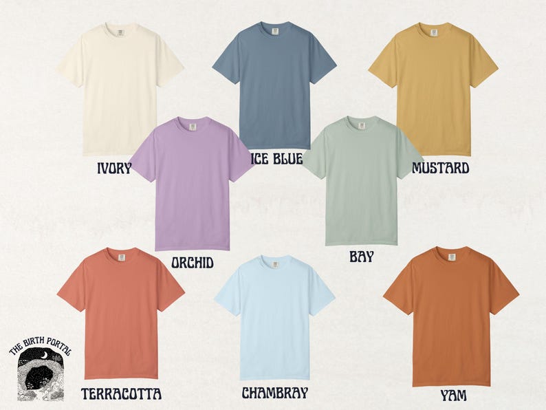 May include: A collection of eight short-sleeved t-shirts in various colors, including ivory, ice blue, mustard, orchid, bay, terracotta, chambray, and yam. Each shirt is displayed on a neutral background with the color name below.