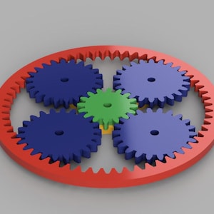 May include: A red gear with four smaller blue gears interlocked inside. The smaller gears are surrounded by a yellow gear in the centre. The gears are all made of plastic.