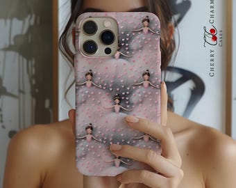 May include: A pink phone case with a pattern of ballerinas in pink tutus and white shoes. The ballerinas are surrounded by small pink hearts. The case has a cutout for the camera lens and a raised lip around the edges to protect the screen.