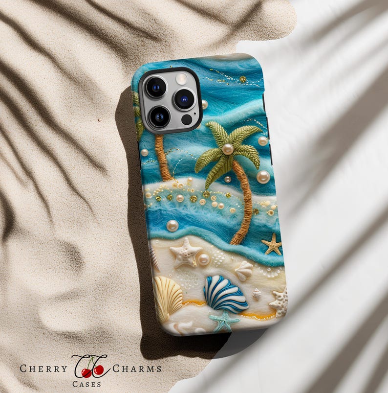 May include: A blue and white phone case with a beach scene. The case features two palm trees, white sand, seashells, and pearls. The case is designed for an iPhone.