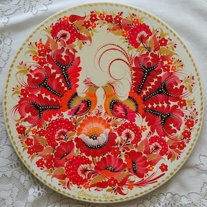 Wooden wall plate Hand-painted Decorative plate on the wall with a pattern of flowers and birdsPainted plate Petrykivka painting Ukraine
