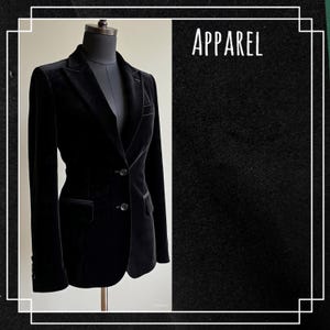 May include: A black velvet blazer displayed on a mannequin. The blazer has a classic design with a notched lapel, two-button closure, and front pockets. The word "APPAREL" is displayed in white text.