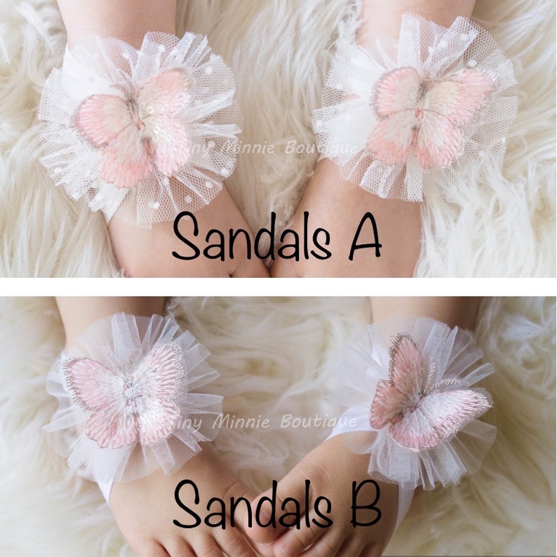 May include: Two pairs of white tulle baby sandals with pink butterfly embellishments. The sandals are labeled "Sandals A" and "Sandals B".