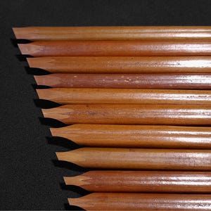 Handam Bili bamboo calligraphy pens featuring natural reed textures and precision-cut nib tips.
