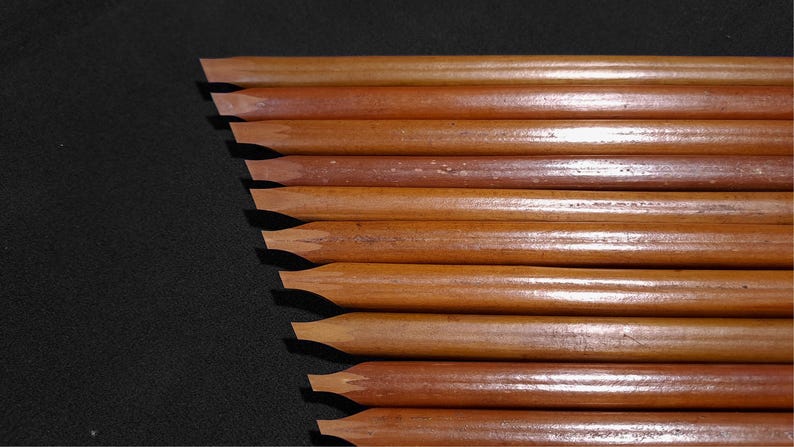 Handam Bili bamboo calligraphy pens featuring natural reed textures and precision-cut nib tips.