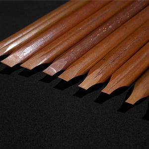 Luxury handmade reed pens with elegant natural textures designed for traditional Arabic calligraphy.