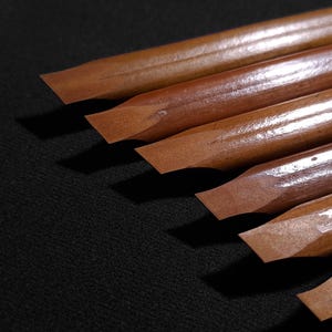 Handmade Arabic qalam pens crafted from natural reed with smooth angled writing edges.