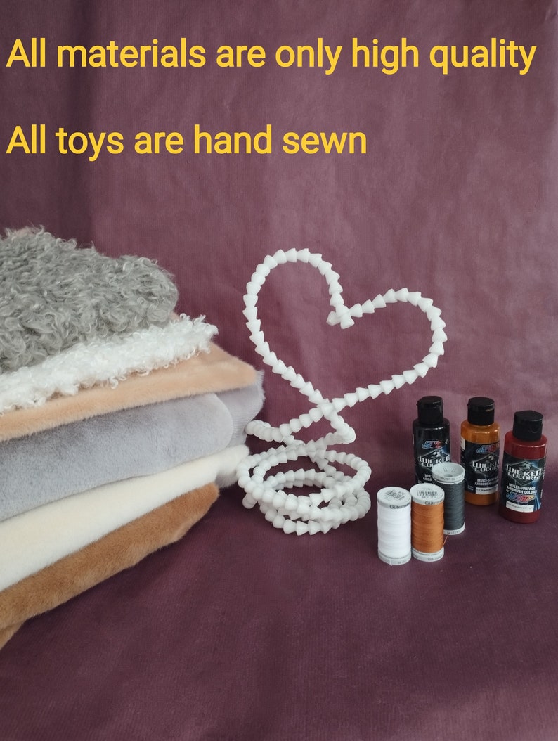 May include: A stack of different colored faux fur fabrics, a white heart-shaped wire, two spools of thread, and three bottles of paint. The text "All materials are only high quality" and "All toys are hand sewn" is visible at the top of the image.