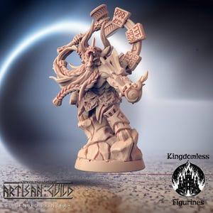 May include: A tan-colored figurine of a horned warrior with a long beard, holding a hammer and a circular object with symbols. The figurine is on a rocky base. The text "Kingdomless" and "Figurines" are visible.