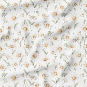 May include: White fabric with a repeating pattern of watercolor daisies. The daisies have white petals and yellow centers, with green stems and leaves. The fabric has a soft, slightly wrinkled texture.