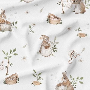 May include: Watercolor illustration fabric featuring a repeating pattern of bunnies engaged in various activities. The bunnies are depicted in soft brown tones, with green foliage and white flowers scattered across a white background. The design evokes a whimsical, pastoral theme.