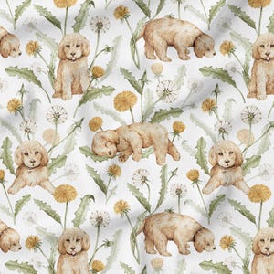 May include: A seamless pattern featuring watercolour illustrations of golden retriever puppies and dandelions on a white background.