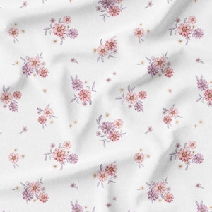 May include: White fabric with a repeating floral pattern. The design features clusters of pink and purple flowers with green leaves and small yellow accents. The fabric has a soft, wrinkled texture.