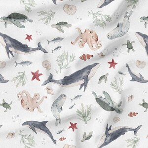 May include: Watercolor pattern featuring various marine life elements. The design includes whales, dolphins, seals, turtles, octopuses, starfish, fish, and coral in shades of blue, green, and red on a white background. The pattern is suitable for nautical or ocean-themed products.