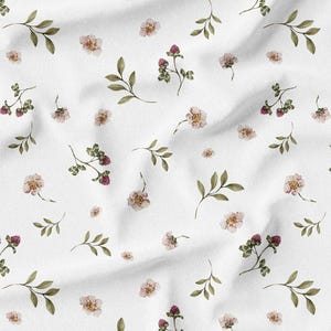 May include: White fabric with a repeating pattern of watercolor flowers and leaves. The design features small, light pink flowers, clusters of red berries, and green leaves scattered across the white background.