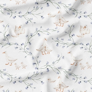 May include: Watercolor pattern featuring white geese with their goslings, set against a backdrop of delicate bluebell vines on a white fabric. The design has a soft, vintage aesthetic, perfect for textiles or nursery decor.