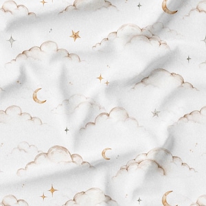 May include: White fabric with a repeating pattern of watercolor clouds, crescent moons, and stars in shades of gold and gray. The design has a soft, dreamy aesthetic, suitable for baby bedding or nursery decor.