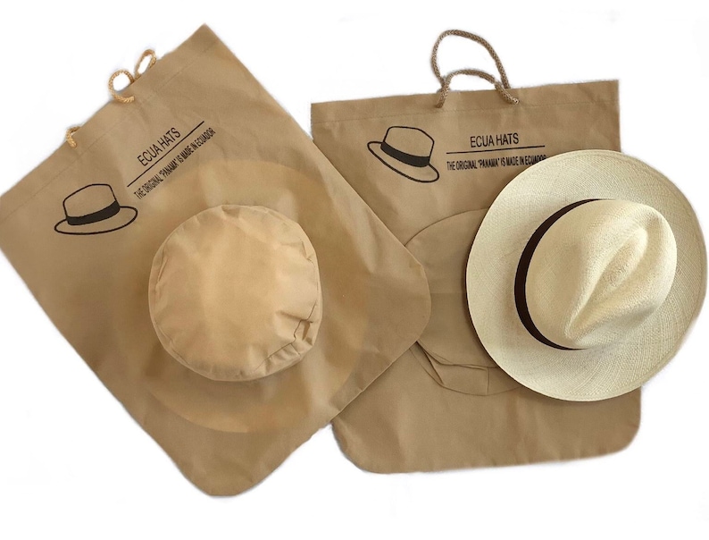 May include: Two brown paper bags with handles, each with a hat inside. The bags have the text "ECUA HATS" and "THE ORIGINAL PANAMA IS MADE IN ECUADOR" printed on them.