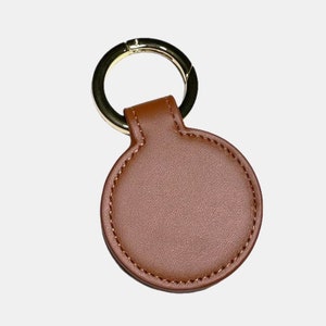 Multifunctional Magnetic Holder Clip for hats, bags or portable accessories. Durable, Safe, Portable ideal for travel. Brown