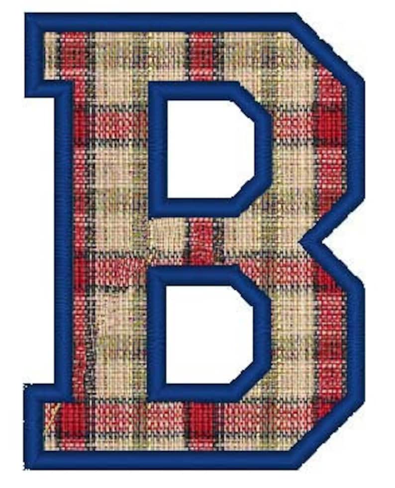 May include: A large, blue outlined letter "B" with a red and beige plaid pattern.