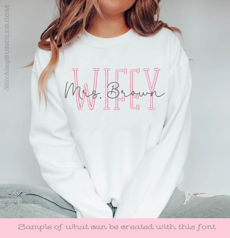 May include: White sweatshirt with the text "WIFEY" in pink outlined letters and "Mrs. Brown" in cursive script below.