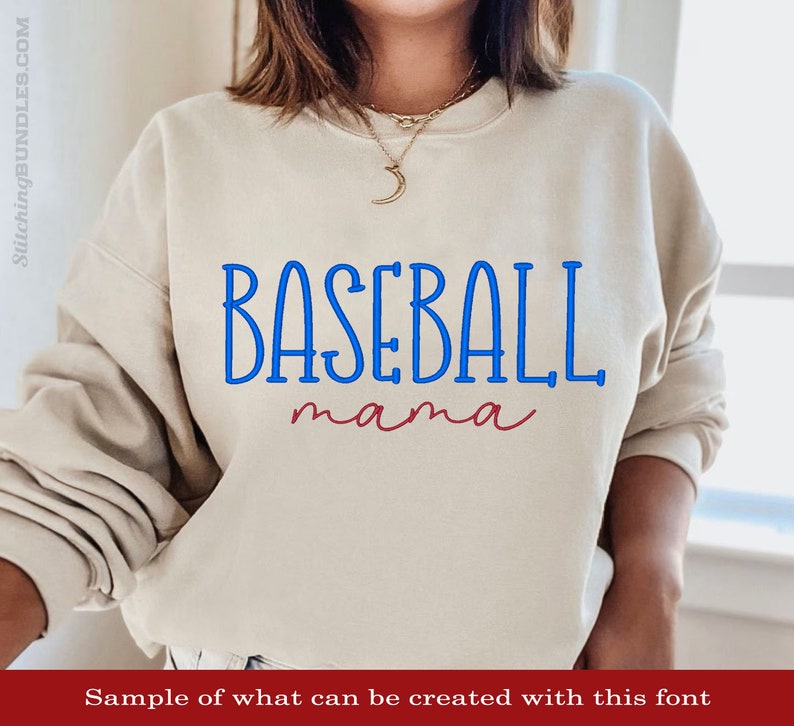 May include: A beige sweatshirt with the text "BASEBALL mama" in blue and red lettering.