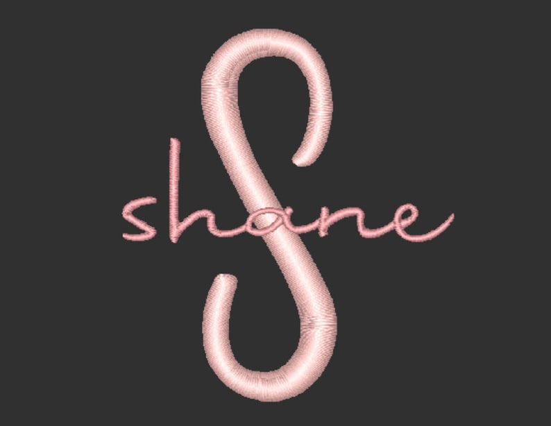May include: Pink embroidered cursive text "shane" with a pink stylized letter "S" in the center.