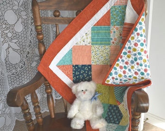 Gender Neutral Baby Quilt "Well Said" by Moda with colors in Blue Green Orange