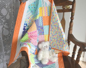 Gender Neutral Baby Quilt "Confetti" by Moda with colors in Pink Blue Purple Green Orange Yellow