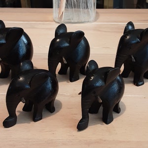 Family of five Carved Ebonized elephants..8cm high to 5 cm high
