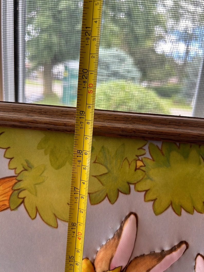 May include: A yellow measuring tape with black markings and red numbers. The tape is extended to 21 inches and shows the numbers 1-315, 1-416, 1-517, 1-618, 1-719, 1-820, 1-921, 50, 1, 2, 3, 4, and 5.