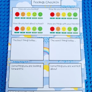 May include: A printable feelings check-in worksheet with a blue background and colourful clouds. The worksheet includes a mood scale with smiley faces, sections for writing about the best and worst things of the day, and prompts for reflecting on things you are looking forward to and worried about. It also includes a section for writing about what you would do if you had a magic wand.