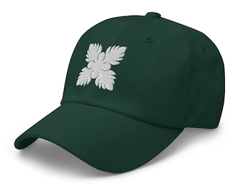 May include: A dark green baseball cap with a white embroidered flower design.