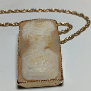C. 1930s-50s Art Deco style rectangular carved shell in a gold tone bezel, in Vintage Very Good Condition. Unmarked, and harder to find.