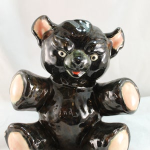 Vintage ceramic Teddy Bear coin bank, in Vintage Good condition.  Cute?  Yes.  Creepy and Menacing?  Also yes.  Someone&#39;s gonna love this..
