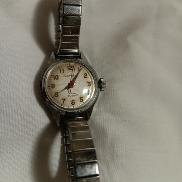 1960s Caravelle By Bulova Ladies Water Resistant Winding Watch, In Vintage Good Condition. Speidel Band. Mechanics Work. Unsure of Accuracy.