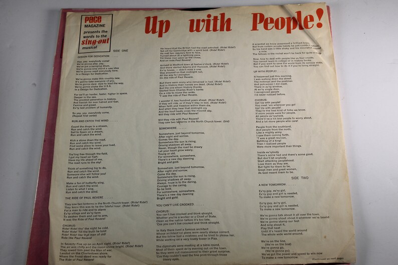 May include: A vintage record album cover with a red, white, and blue color scheme. The album is titled "Up with People!" and features lyrics from the musical. The cover includes a photo of a group of people singing and dancing.