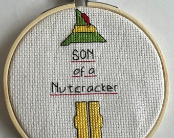 Elf “Son of a Nutcracker” Cross Stitched Ornament/Sign